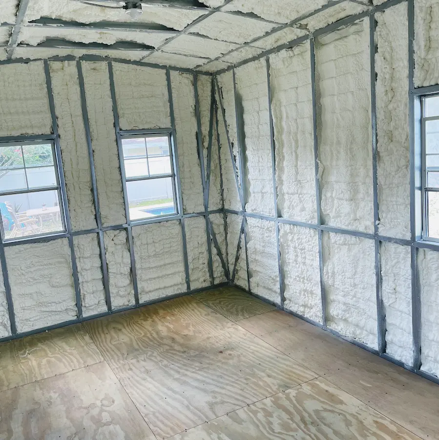 Closed-cell spray foam insulation applied to wall cavities in a residential project in Elgin